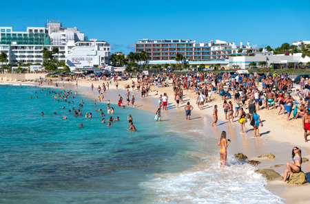 Philipsburg, St Maarten - January 27, 2019: A  crowd of tourists on Maho beach  in front of the Princess Juliana airportのeditorial素材