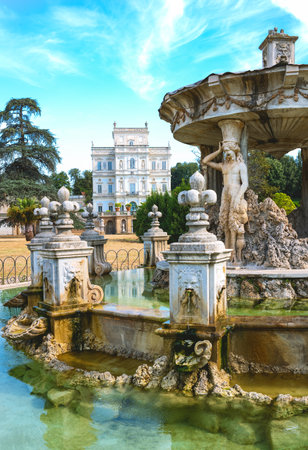 Italy, Rome, Villa Doria Pamphili, the Del Cupido fountain with the Casino Del Bel Respiro palace in the backgroundのeditorial素材