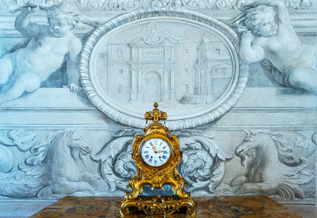Rome, Italy -January 11, 2019: An antique table clock in the Alessandro gallery of the  Quirinale palace seatのeditorial素材