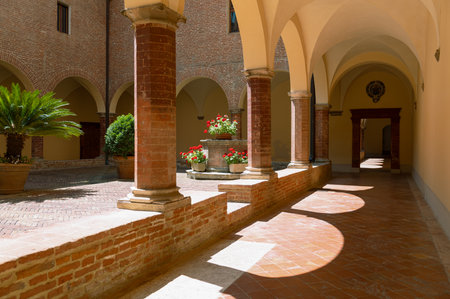 Asciano, Italy - June 25,2020: Abbey of Santa Maria of Monte Oliveto Maggiore, the cloister