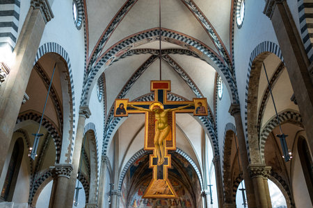 Florence, Italy - February 13, 2019: Main nave of the Basilica of Santa Maria Novella, the wwoden crucifix by Giottoのeditorial素材