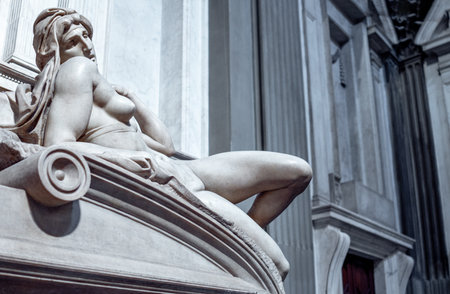 Florence, Italy - February 14, 2019: Medici chapels, the tomb of the Duke of Urbino, by Michelangelo, detail of the reclined statue represemting the Duskのeditorial素材