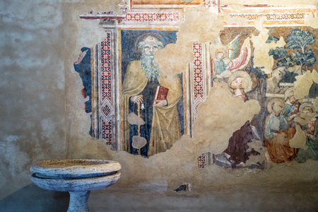 Castelnuovo dell'Abbate, Italy - September 20, 2019: Municipaliry of Montalcino, sacred paintings and statue in the side nave of the St. Antimo abbey (twelth century)のeditorial素材