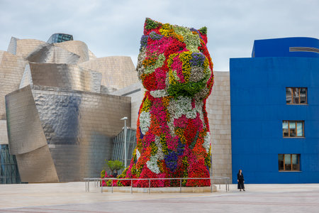 Bilbao, Spain - June 14, 2018: Worlds largest flower sculpture of Puppy in front of Guggenheim Museum of modern and contemporary artのeditorial素材