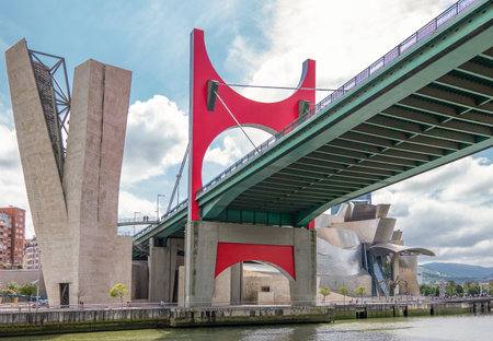 Bilbao, Spain - June 16, 2018: The La Salve bridge with the Guggenheim museum in the background