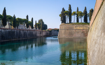 Italy, Peschiera del Garda, the ancient fortified walls of the town on the Mincio river