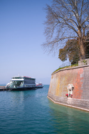Italy, Peschiera del Garda, the harbor on the Garda lake with the ancient fortified walls of the townの写真素材