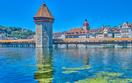 Lucerne, Switzerland, the wooden covered Chapel bridge with the octagonal Water tower on the Reuss riverの写真素材