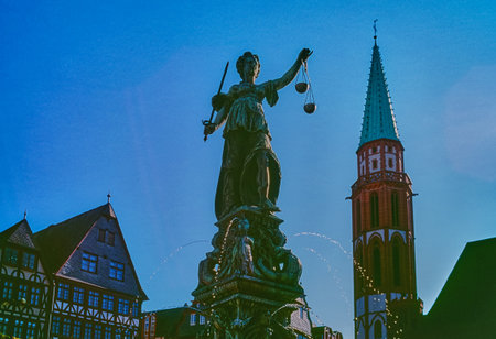 Germany, Frankfurt, the statue of the fountain of justice in Romemenberg squareの写真素材