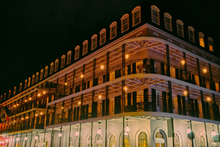New Orleans, United States, French Quarter, night view of a building with the traditional cast iron balconyの写真素材