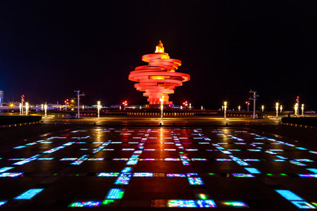 Qingdao, China, 09/22/2015. May 4th square (Wu Si Guangchang) is a popular tourist attraction in Qingdao and is beautifully lighted at night.のeditorial素材