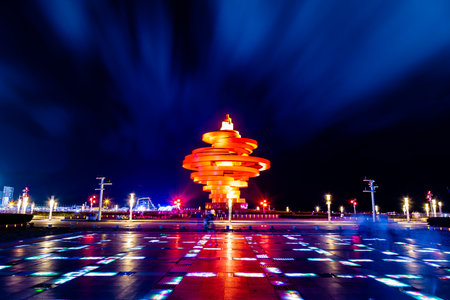 Qingdao, China, 08/06/2016. May 4th square (Wu Si Guangchang) is a popular tourist attraction in Qingdao and is beautifully lighted at night.のeditorial素材