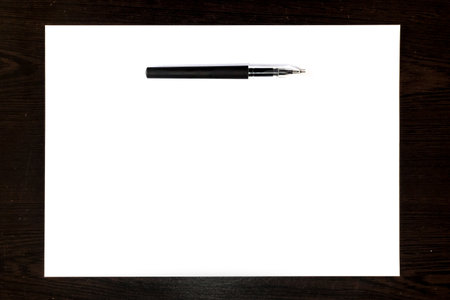 Isolated black pen on white paper sheet, template ready for your designの写真素材