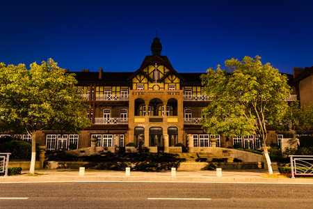 Old german Guesthouse in Bathing Beach N1 in a summer night, Qingdao, Chinaのeditorial素材