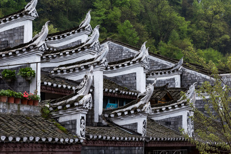 Typical Miao decorations on the roofs of Fenghuang Ancient Town, Hunan province, China.の写真素材