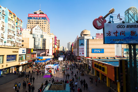 March 2016 - Qingdao, China - Taidong walking street, the most famous shopping street of Qingdao, home of a crowded night market. This street is also famous for the mural paintings on buildingsのeditorial素材