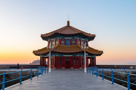 Zhanqiao pier at sunrise, Qingdao, Shandong, China. The name "Huilan Pavilion" is engraved above the entrance door.のeditorial素材