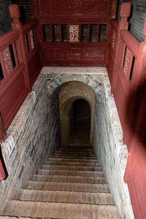 The entrance of the underground fortress of Zhangbi Cun, near Pingyao, China. 1400 years old and stretching for more than 10 km, it is the oldest and longest network of tunnels of all of Chinaのeditorial素材