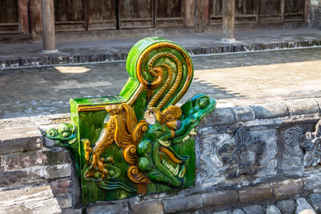 A dragon ornament in the village of Zhangbi Cun, near Pingyao, China, famous for it's underground fortress which is the oldest and longest network of tunnels of all of Chinaの写真素材