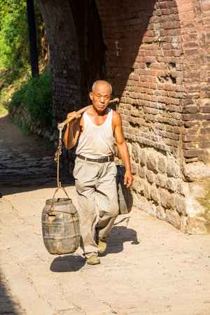 Aug 2013 - Zhangbi Cun, China - Daily life scenes in the streets Zhangbi Cun, a village near Pingyao famous for it's underground fortress which is the oldest and longest network of tunnels of all of Chinaのeditorial素材