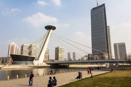 March 2014 - Tianjin, China - People walking along the Haihe river in Tianjinのeditorial素材