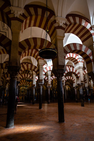 Oct 2018 - Cordoba, Spain - The famous arched interiors of Mezquita, Catedral de Cordoba, a former Moorish Mosque that is now the Cathedral of Cordoba. Mezquita is a UNESCO World Heritage Site.のeditorial素材