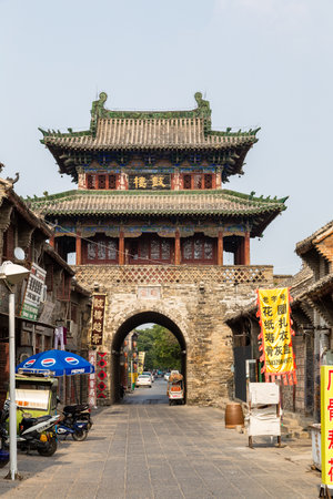 July 2016 - Luoyang, China - the small street that runs through the ancient city of Luoyang, in front of the Old Drum Tower. Luoyang is one of the 4 ancient capitals of Chinaのeditorial素材
