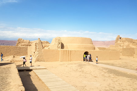 Aug 2017, Ruins of Gaochang, Turpan, China: tourist in the buddhist temple area. Dating more than 2000 years, Gaochang and Jiaohe are the oldest and largest ruins in Xinjiang.のeditorial素材