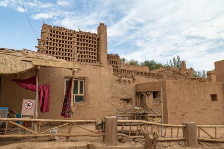 Aug 2017 Tuyoq village (Tuyuk): one of the streets of this traditional Uighur village sets a lush valley cutting through the flaming mountains near Turpan, Xinjiang, Chinaのeditorial素材