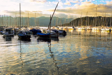 boats at sunset in golden watersの写真素材