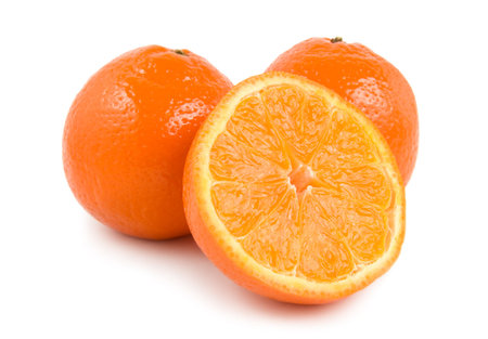 Three perfectly fresh oranges isolated on whiteの写真素材