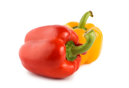 Yellow and red pepper isolated on white backgroundの写真素材