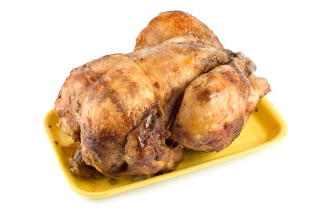 Fried chicken on a plate isolated on white backgroundの写真素材
