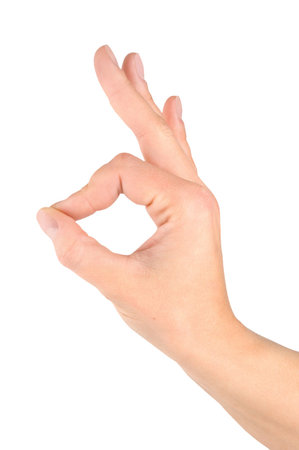 Hand simulating Ok sign isolated on a white backgroundの写真素材