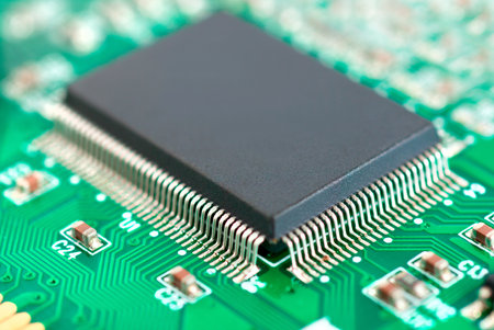 Bright green background with motherboard's electronic circuitの写真素材