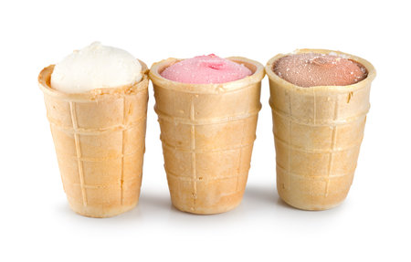 Three different flavors of ice cream cones... chocolate, vanilla, and strawberry の写真素材