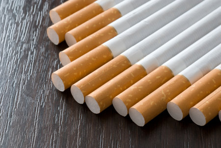 Cigarettes on the black tableの写真素材
