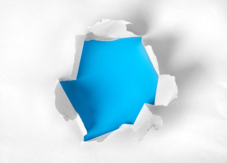 Paper torn with blue backgroundの写真素材