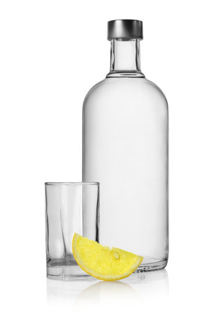 Bottle of vodka and lemon isolatedの写真素材