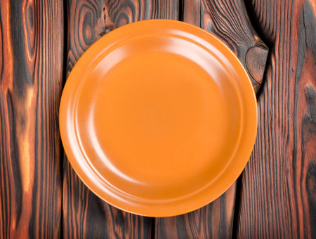 Plate on a wooden tableの写真素材