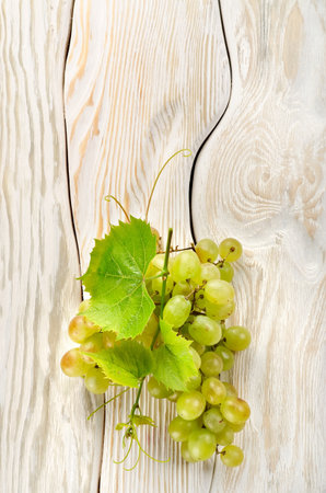 Green grapes on the tableの写真素材