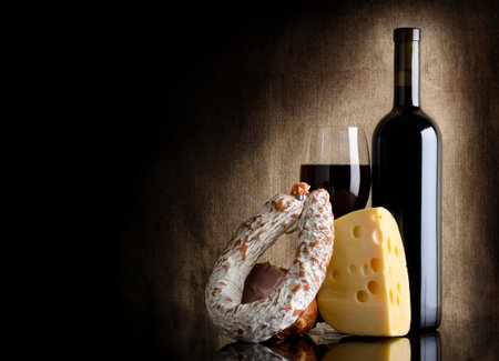 Wine bottle and cheeseの写真素材