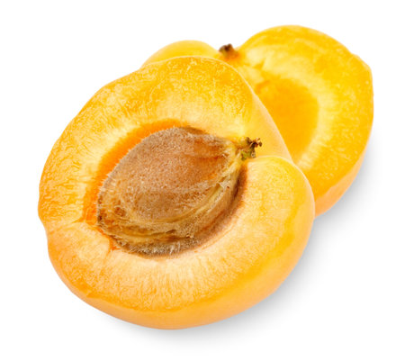 Ripe apricot sectioned by knifeの写真素材