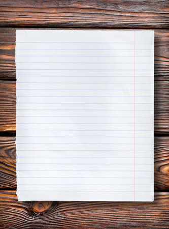 Lined paper on dark tableの写真素材
