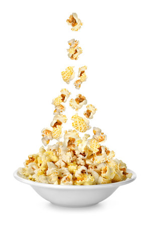 Popcorn falling in the plateの写真素材