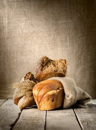 Bread assortment on background of the old canvasの写真素材