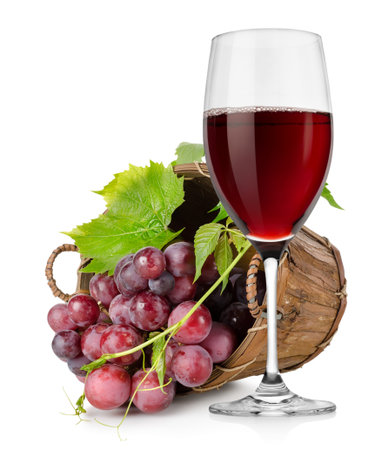 Wineglass and  grapes in a basketの写真素材