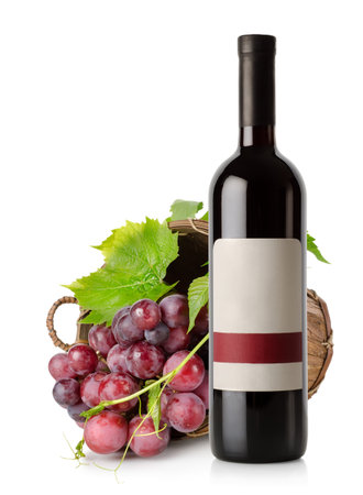 Wine bottle and grape in basketの写真素材