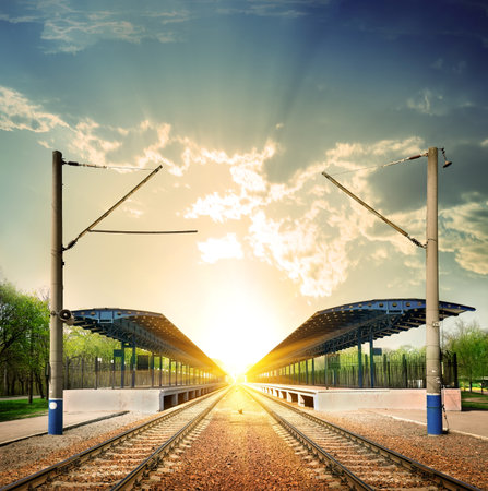 Railway station at sunset in sunlightの写真素材