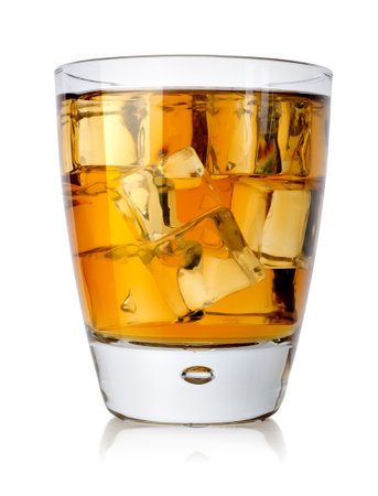 Brandy glass with brandy and ice isolated on a white backgroundの写真素材